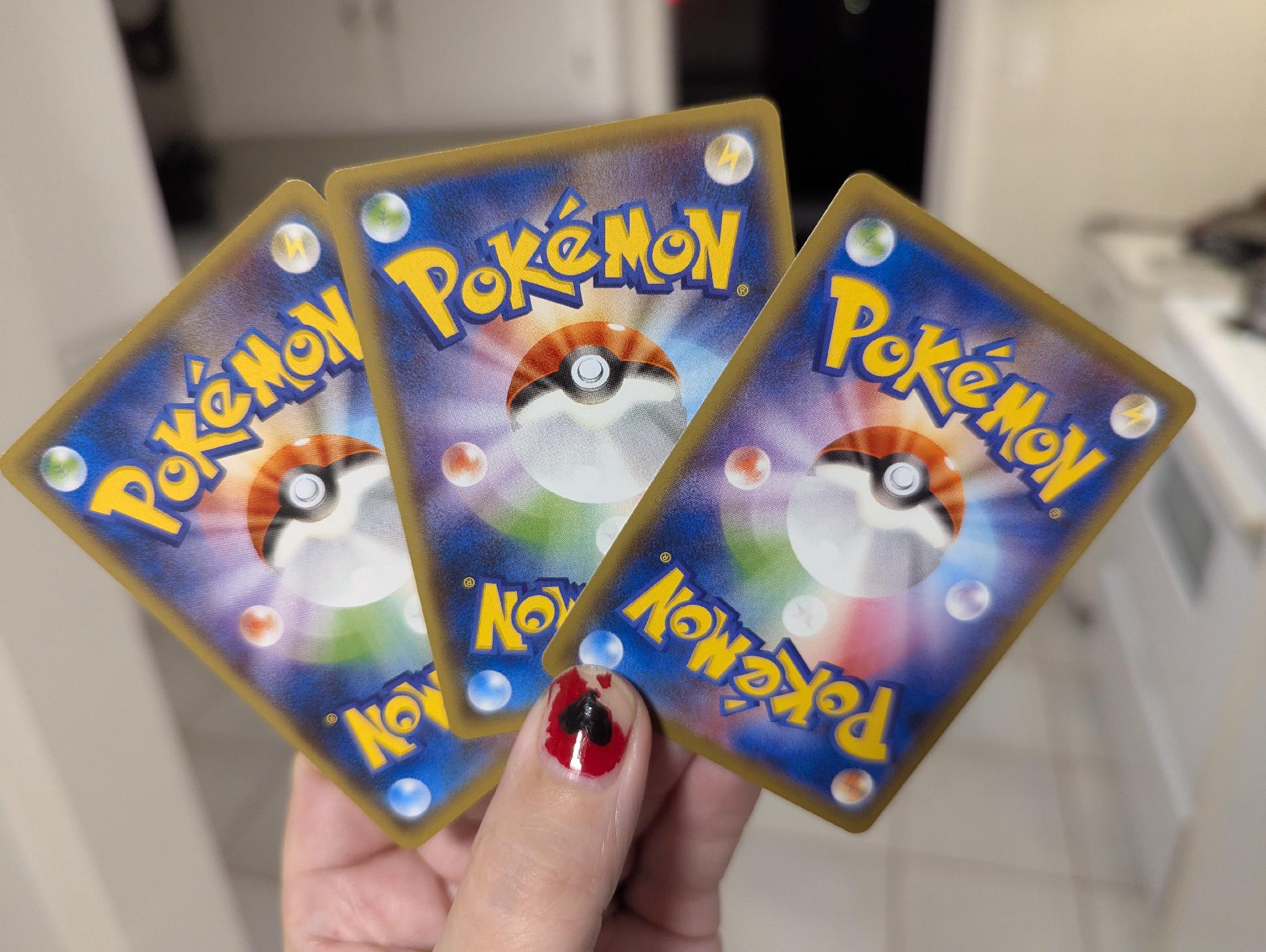The card backs, which seems different from the card backs I'm used to seeing somehow