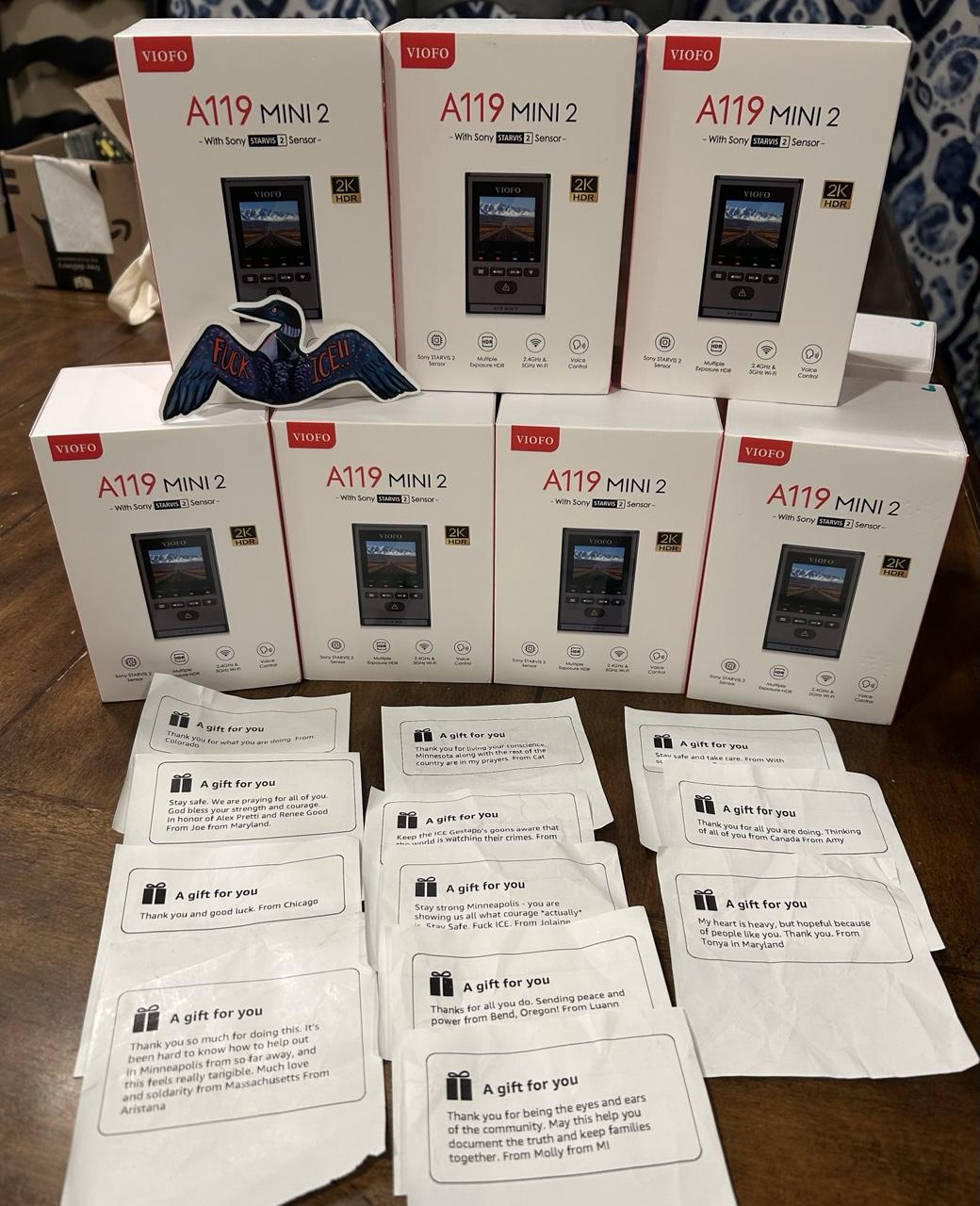 A stack of dash cams and encouraging notes