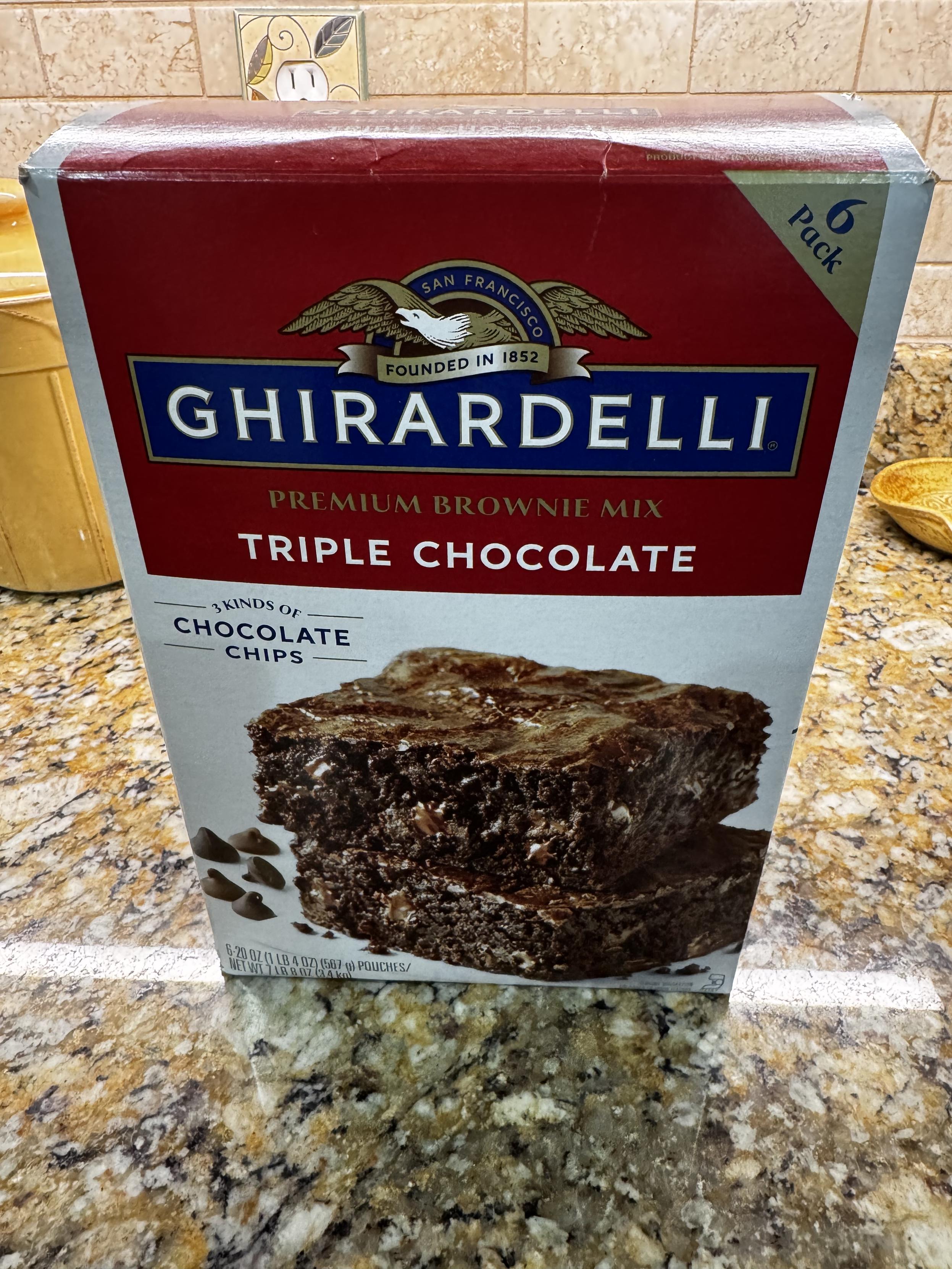 A very large, Costco-sized package of Ghirardelli triple chocolate brownie mix sits on a granite countertop.  I'm so lucky that I complained about all the lack of sleep this morning AND the fact that Charlie had BROWNIES in the middle of the night, that I'm not even having to make them myself.