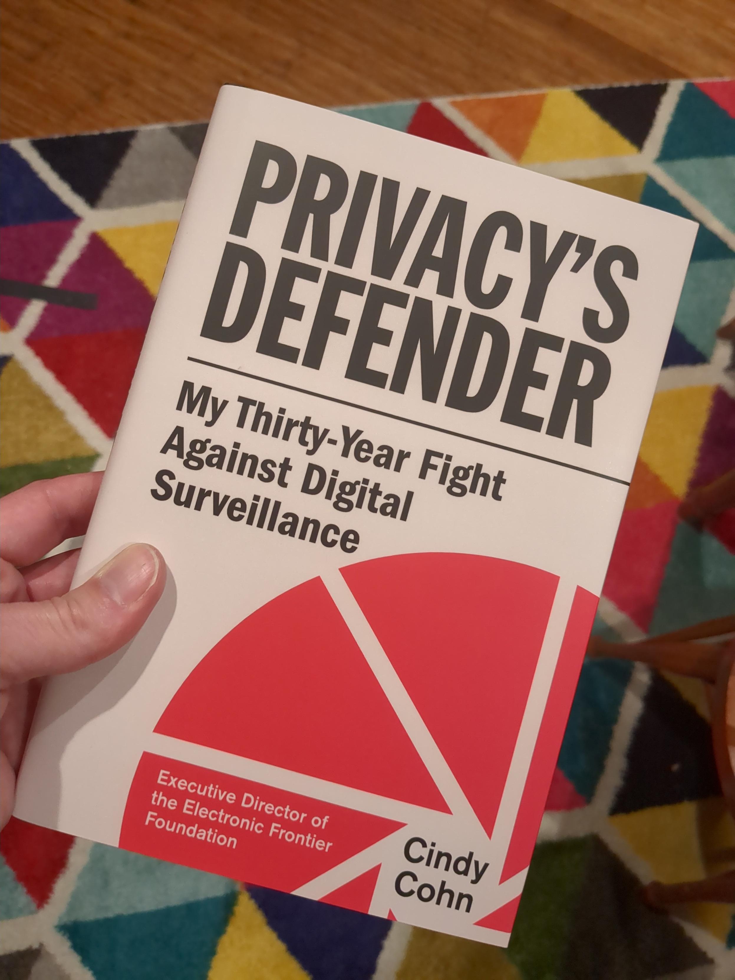 hand holding the hardcover book, Privacy's Defender, My Thirty-Year Fight Against Digital Surveillance