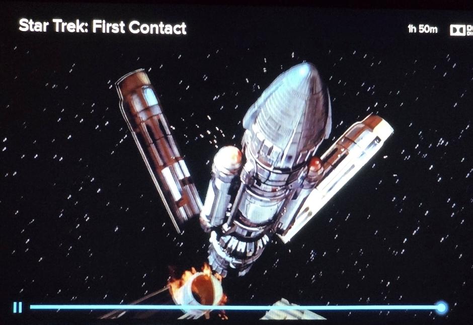 Cochrane's rocketship flight when the first stage separation happens in starry black space.