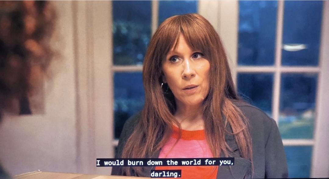 Catherine Tate as Donna Noble in the Doctor Who Special (Number One). She is looking a bit fierce as she says to her gorgeous daughter Rose, "I would burn down the world for you, Darling." They are in their kitchen, french doors behind them.