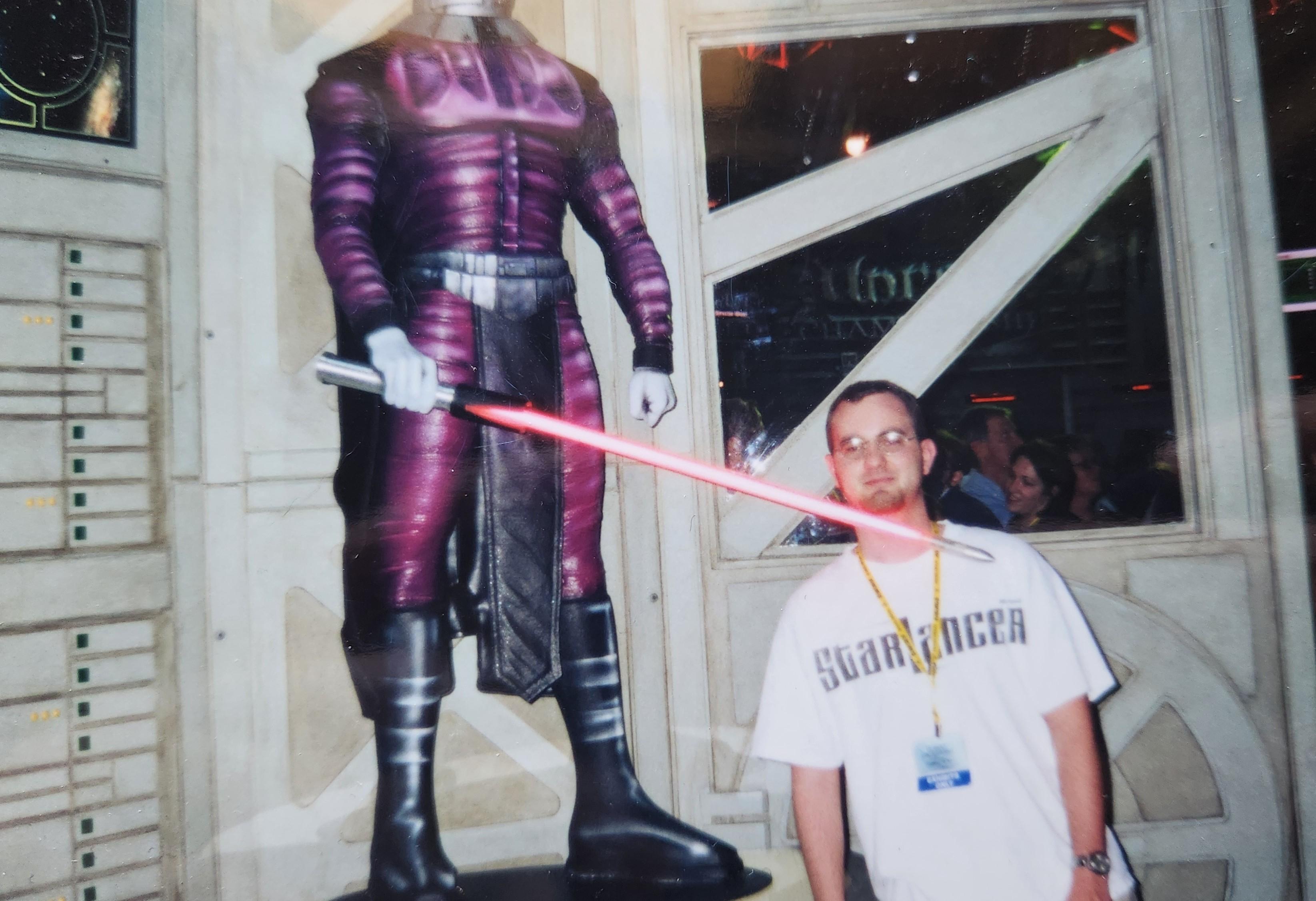 Me wearing a StarLancer shirt posing with a KOTR display