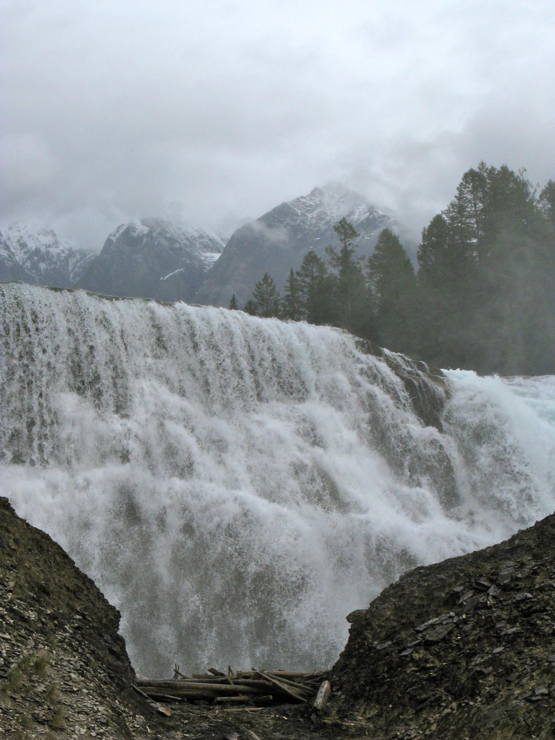 A 20m high, 100m wide fall on the Kicking Horse river, with a very large volume of water.  This was September, 2010 and we were fortunate with the weather on this trip:  While overcast and cool we had little rain and no snow.

The "hike" from a parking area to the falls was fairly flat again.  We saved the elevation gains (and losses) for different days.