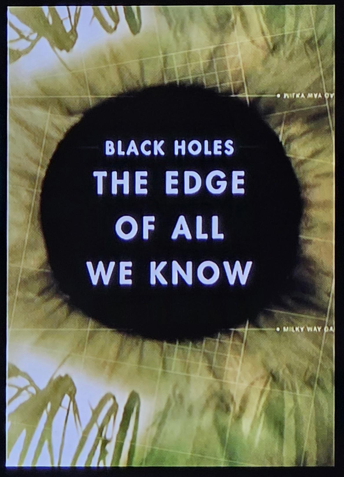 Abstract photo looks like a green eye with the pupil or a sunflower with the center being a black circle. 
Black Holes The Edge of all We Know