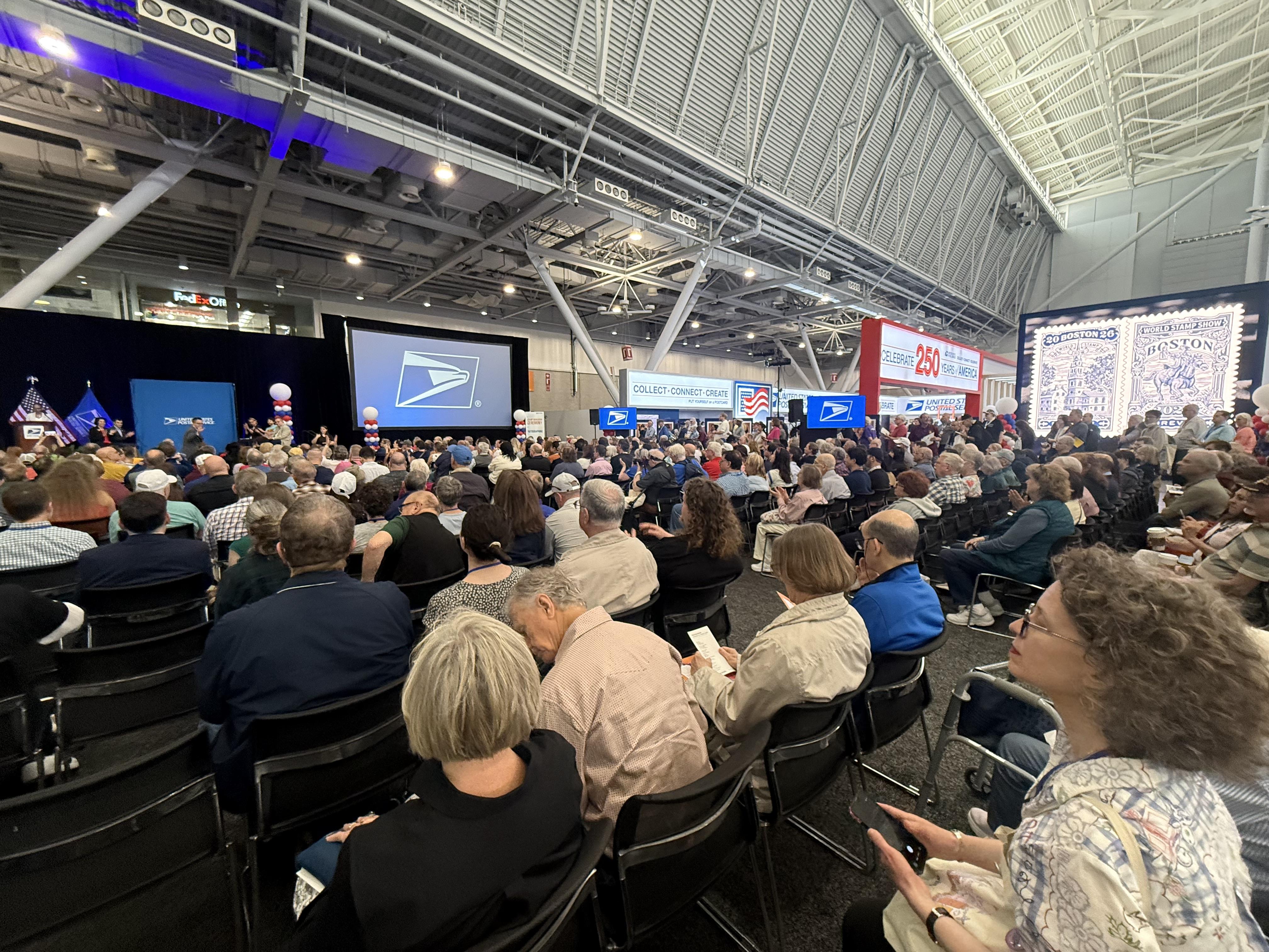 Small section of the massive Boston convention center packed with folks. Mostly white, and old