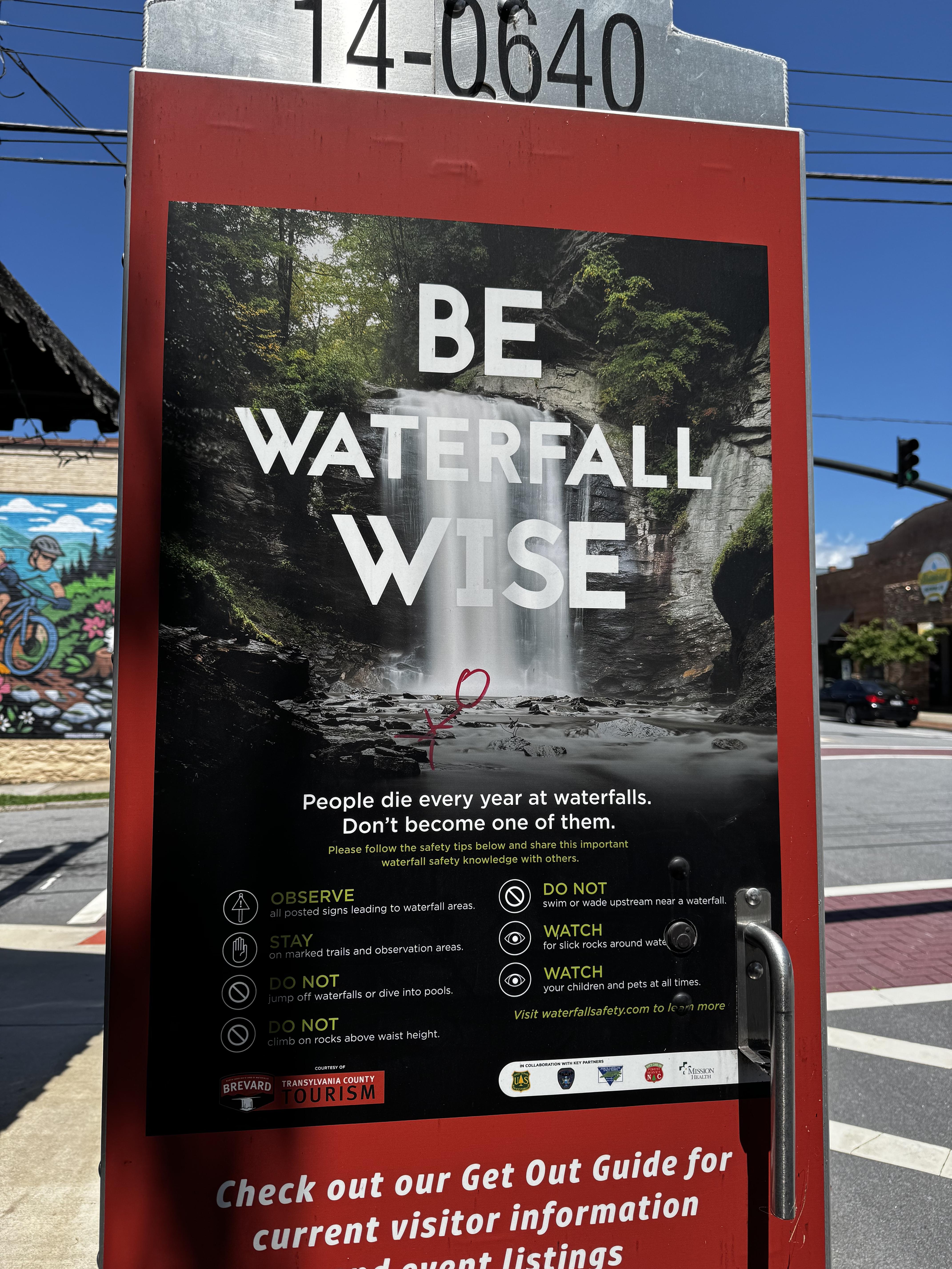 A large, professional placard is attached to a light pole on a sidewalk in Brevard.  It states "BE WATERFALL WISE" and that "People die every year at waterfalls.  Don't be one of them," then goes on to list things to do and not do at some of the countless waterfalls we have in this part of WNC.  

Serious stuff, and yet each year you see parents letting their kids slide all over those rocks.